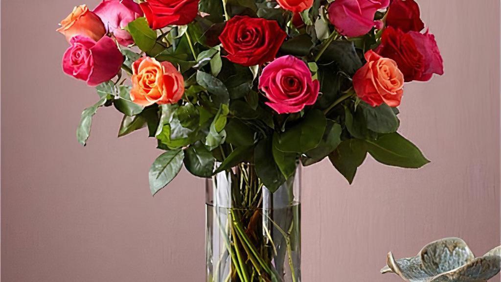 24 Mixed Rose Bouquet · Live happily with the Ever After Mixed Rose Bouquet. This arrangement features two dozen roses in three vibrant hues: orange, hot pink, and red. This trifecta will warm any space they're displayed in and any recipient's heart. Vase included.