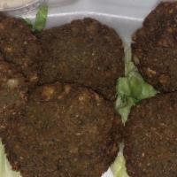 Falafel · Vegetarian. 6 Fried Chickpea Patties Served with Tahini Sauce.