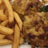 Fried Crab Cake With French Fries · Delicious fried crab cake served with garlic sauce and house salad.