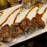 Dragon Roll · Eel and cucumber wrapped with avocado and tobiko on top