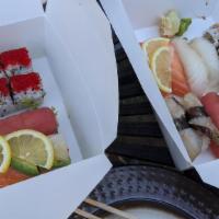 Rainbow Roll · Crabmeat, cucumber, and avocado inside with tuna, salmon, sea bass, and yellowtail outside