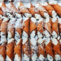 Cannoli · Sicilian pastry. Fried pastry dough filled with sweet ricotta cream.