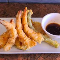 Tempura Shrimp And Veggie · 4 pieces deep fried shrimp and assorted vegetable topped with 7-spice.