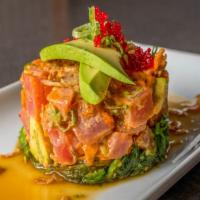 Tuna Poke · Hawaiian style spicy tuna and avocado tartare on seaweed salad dressed with shallots, ponzu,...