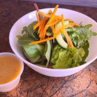 House Salad · Romaine hearts, spring mix, cucumber, carrot and ginger dressing.