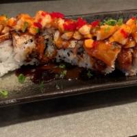 Trifecta Roll · Spicy tuna topped with sliced albacore and torched creamy white tuna.