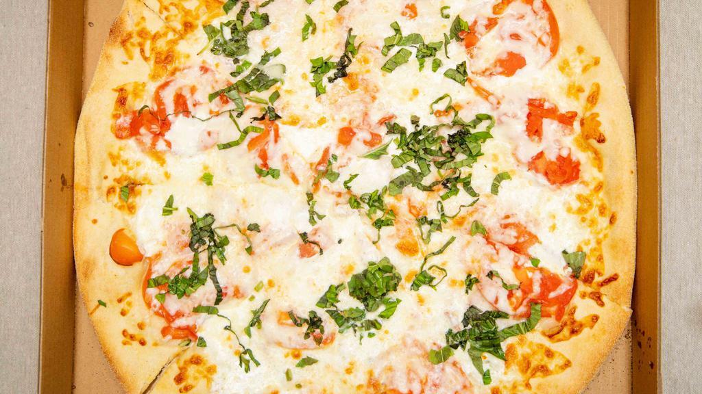 Margarita Pizza · White pizza, fresh mozzarella, tomato, fresh basil, and cheese.