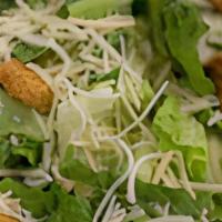 Chicken Caesar Salad · Crisp romaine lettuce, shaved parmesan, tomato, and our all natural hormone free chicken tos...
