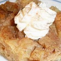 Spiced Apple Bread Pudding · Vegetarian. Bread pudding with sliced apples in a spiced cider anglaise sauce.