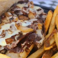 Cheesesteak · Shaved Ribeye, American cheese, fried onions on a 6in steak roll or wrap