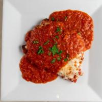 Pollo Parmigiana · Chicken breast, lightly breaded, golden fried, topped with marinara sauce and mozzarella che...