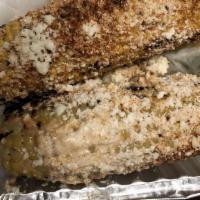 Elote · Grilled corn with cheese and mayo.