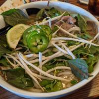 Pho · Traditional beef broth, rice noodle, thinly sliced top round beef, sliced beef brisket, onio...