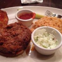 Pulled Pork Sandwich · Smoked pulled pork tenderloin slow-cooked and marinated in our BBQ sauce and topped with col...