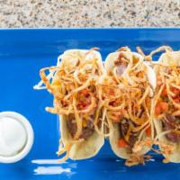 Steak Fajita Tacos · Marinated grilled steak roasted poblano peppers bacon caramelized onions, cheddar cheese and...