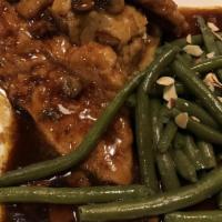 Chicken Marsala · Boneless chicken breasts lightly breaded and sauteed with mushrooms, chicken stock, and mars...