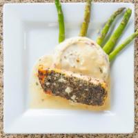 Herb Crusted Filet Of Salmon · Eight oz. fresh salmon with a delicious lemon butter sauce, served over garlic mashed potato...