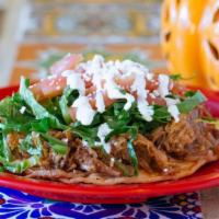 Sopes · Open face home made corn tortillas, smothered with beans, topped with the meat of your choic...