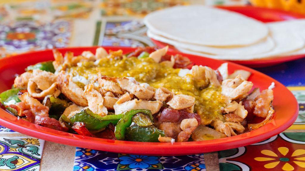 Alambre · A combination of bell peppers, bacon, onions and cheese. Serve with corn tortillas. Your choice of meat.