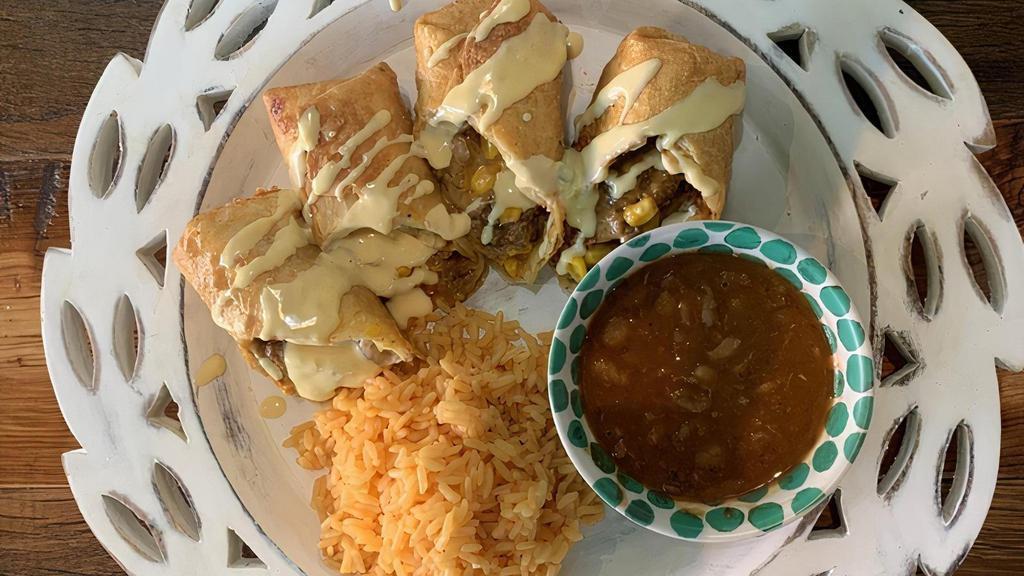 Chimichangas · 2-8 inch Deep fried ground beef, corn and cheese burrito (seasoned to perfection). . 