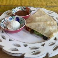 Vegetarian Quesadilla · 12-inch flour tortilla with Mexican cheese + roast vegetables. Served with sour cream and sa...