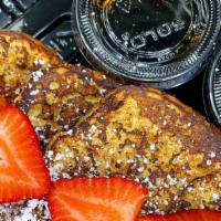 French Toast · 3 slices of thick cut brioche French toast. Topped with powdered sugar and fresh strawberries.