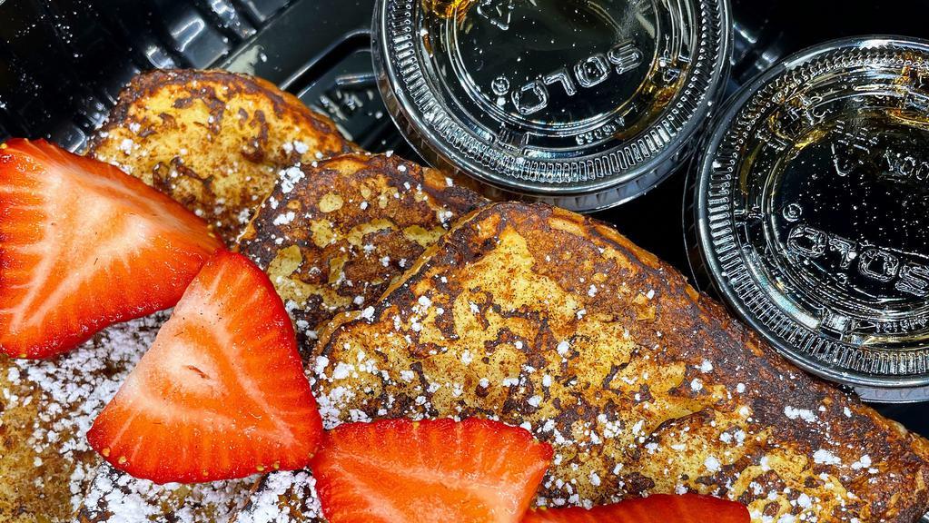 French Toast · 3 slices of thick cut brioche French toast. Topped with powdered sugar and fresh strawberries.