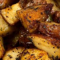 Roasted Potatoes · Cajun roasted potatoes with peppers and onions.