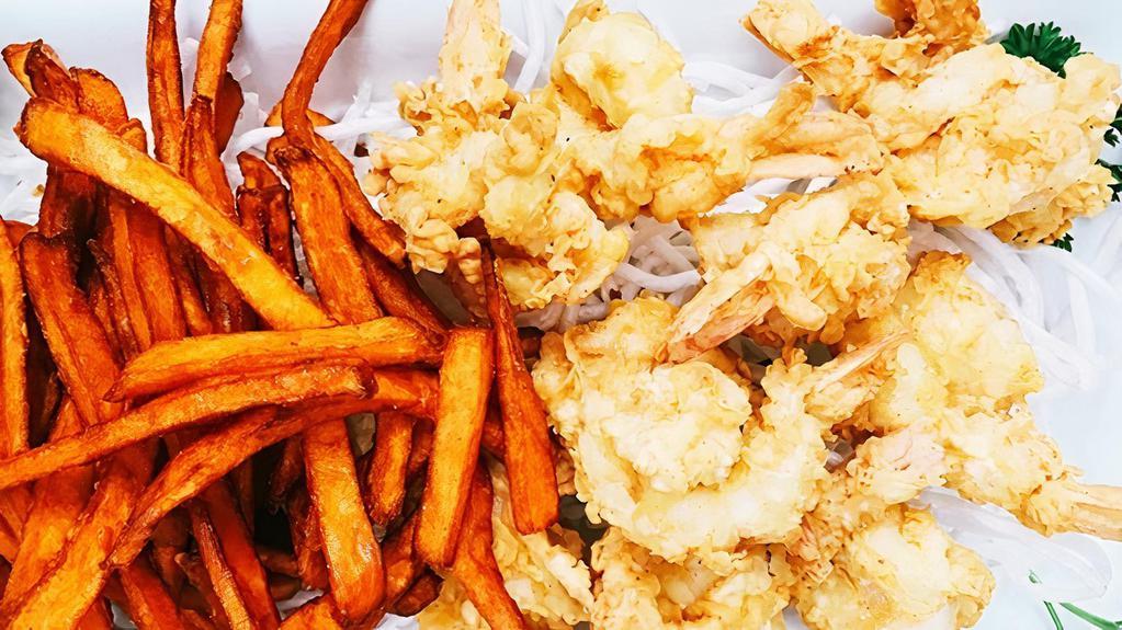 Fried Lightly Breaded Jumbo Shrimp With 2 Sides · Lightly breaded jumbo shrimp coated in seasoned breadcrumbs, then deep fried to golden brown perfection, served with two side dishes and choice of bread on the side. We fry in premium canola oil.