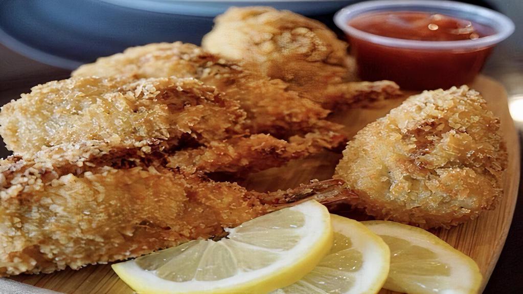 Seafood Platter C · Comes with 3 stuffed shrimp, 2 whiting, served with two side dishes and choice of bread on the side. We fry in premium canola oil.