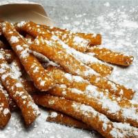 Funnel Cake Fries · Funnel cake fries topped with powdered sugar.