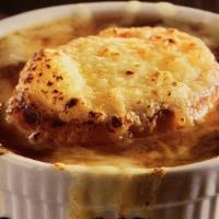 French Onion Soup · French soup consisting of a base of stock and onions served gratinéed with croutons or a lar...