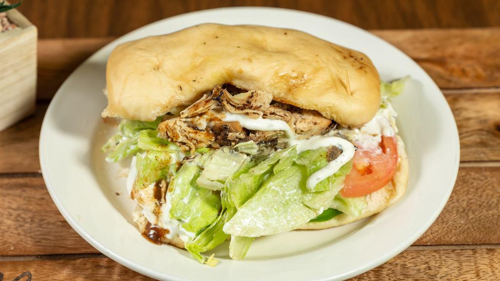 Jerk Sandwich · Jerk sandwich served with ranch, lettuce, tomatoes, and green peppers.