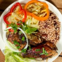 Jerk Chicken · Served with rice & peas and veggies.