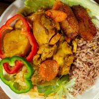 Curried Chicken · Served with rice & peas and veggies.