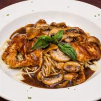 Veal Marsala · Veal scaloppini sauteed with marsala wine with mushrooms & brown sauce, over pasta.