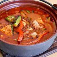 Spicy Sichuan Fish · White fish simmered in a spicy broth with Chinese napa, onions, red and green peppers, and t...