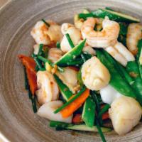Seafood In X.O. Sauce (G) · Stir-fried scallop, shrimp, squid, and white fish tossed with chives, ginger, carrots and sn...