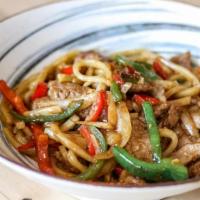 Stir-Fried Beef Udon · Udon noodles wok-tossed with beef, red and green peppers, onions, and scallions