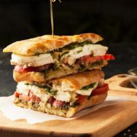 Chicken Alla Italiana Sandwich · Delicious sandwich made with grilled chicken, roasted peppers, broccoli rabe, garlic, and pr...