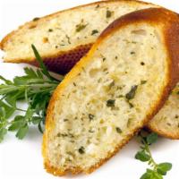 Garlic Bread · Fresh bread topped with garlic and herb seasoning and baked till perfection.