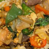 Drunken Noodles · Spicy. Spicy Thai-style dish wide rice noodles stir-fried with eggs, assorted vegetables and...