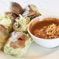 Grilled Sliced Meat Summer Rolls · Shredded lettuce, mint, and rice vermicelli combined with a choice of sliced pork, chicken, ...