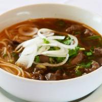 Hue Special Soup · Large vermicelli hue special soup with sliced shin meat and pork hocks. Comes with shredded ...