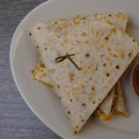 Breakfast Quesadilla · Scrambled eggs, cheese, chorizo sausage, onions and peppers with side of salsa.