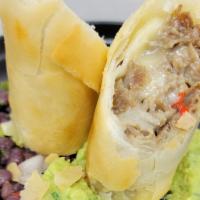 Cheese Steak Spring Roll · Bell peppers, onions, black bean salsa, and guacamole.