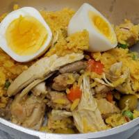 Arroz Con Pollo · Boneless chicken breast and thighs, saffron rice, hard boiled egg, chorizo, onions, peppers,...