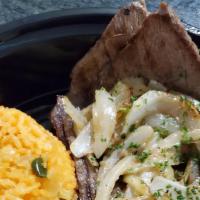 Bistec Encebollado · Pan seared steak, sauteed onions with avocado.