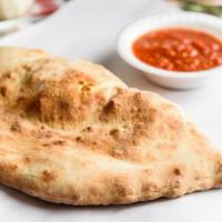 Meatball Calzone · Calzones include mushrooms onions peppers sauce and cheese.