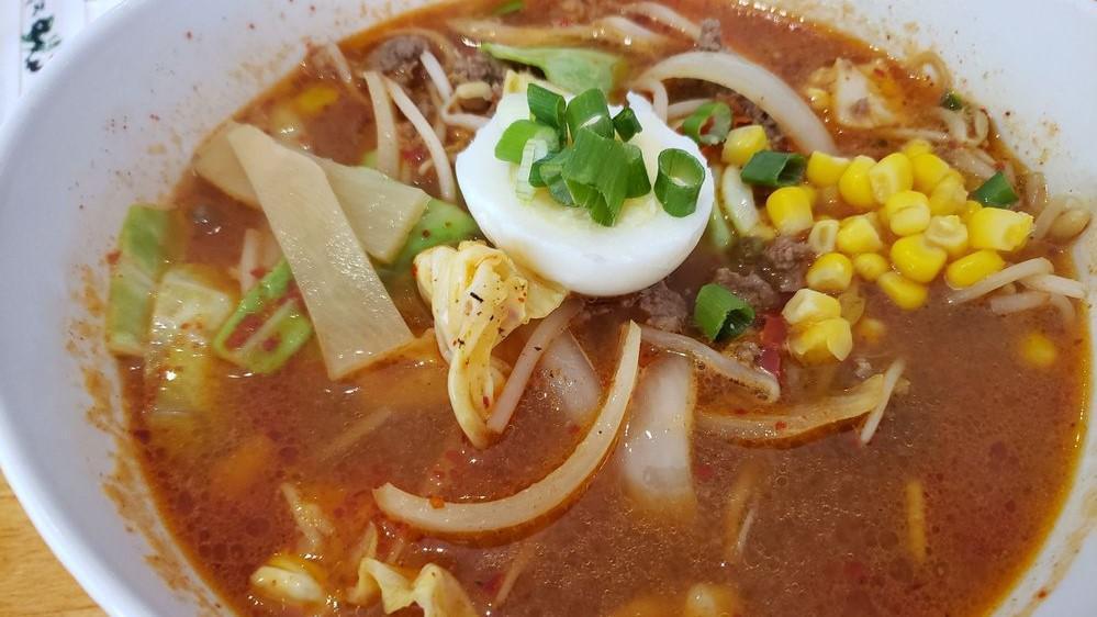 Spicy Miso Ramen (Contains Shrimp) · Combined seasoned pork and beef, cabbage, Carrots, onions, bean sprouts, nira, bamboo shoot, green onion, and egg.